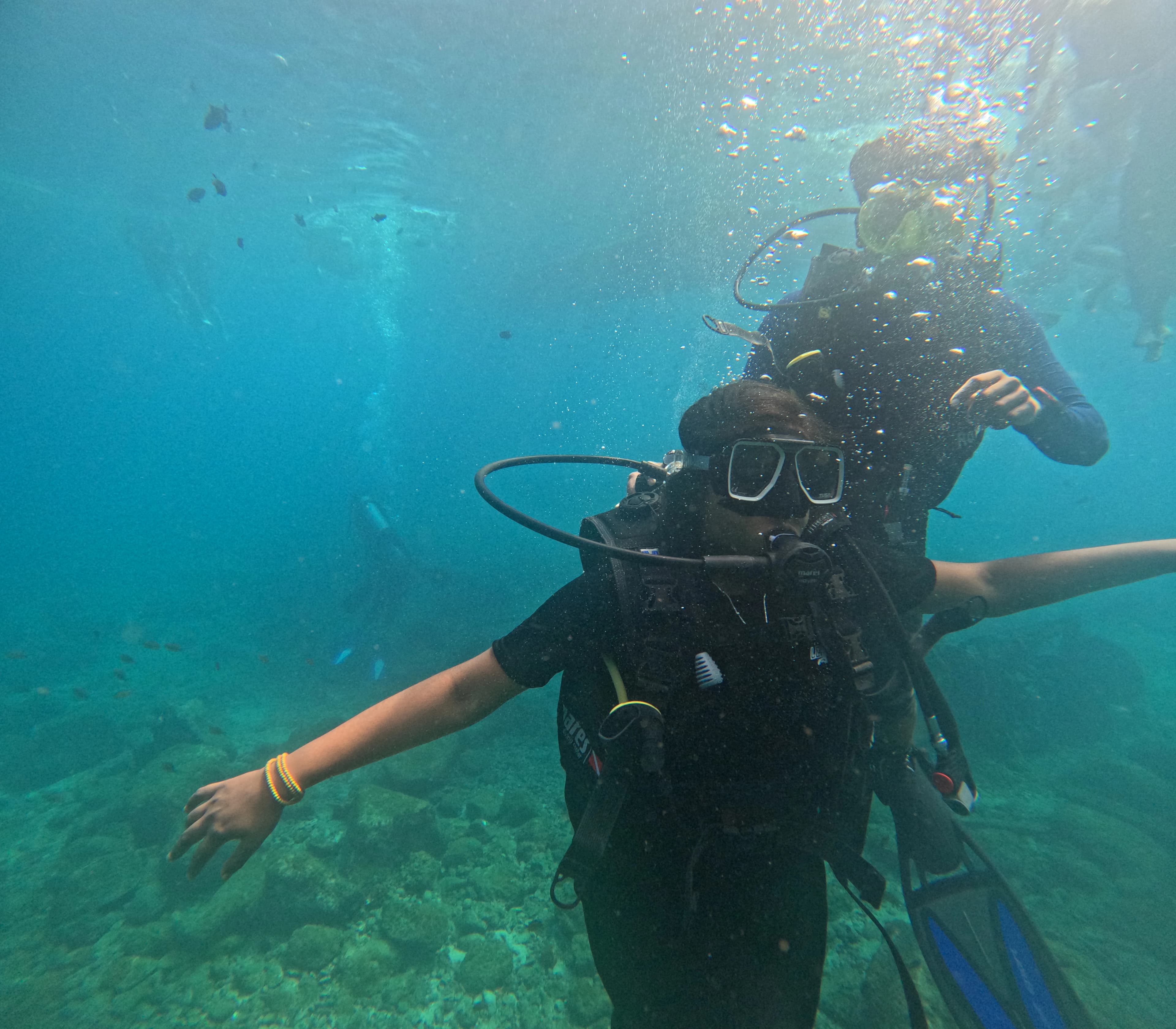 First-time scuba diver experiencing Netrani Island coral reef with Netrani Scuba Dive certified guide